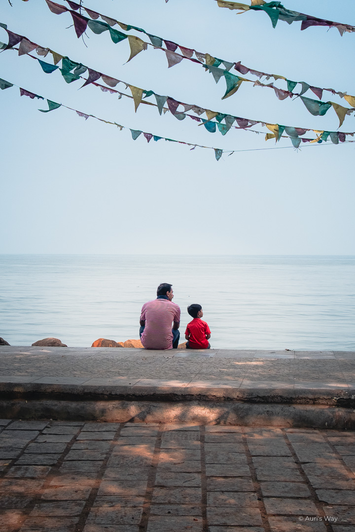 father and son looking at the sea in Kochi, India